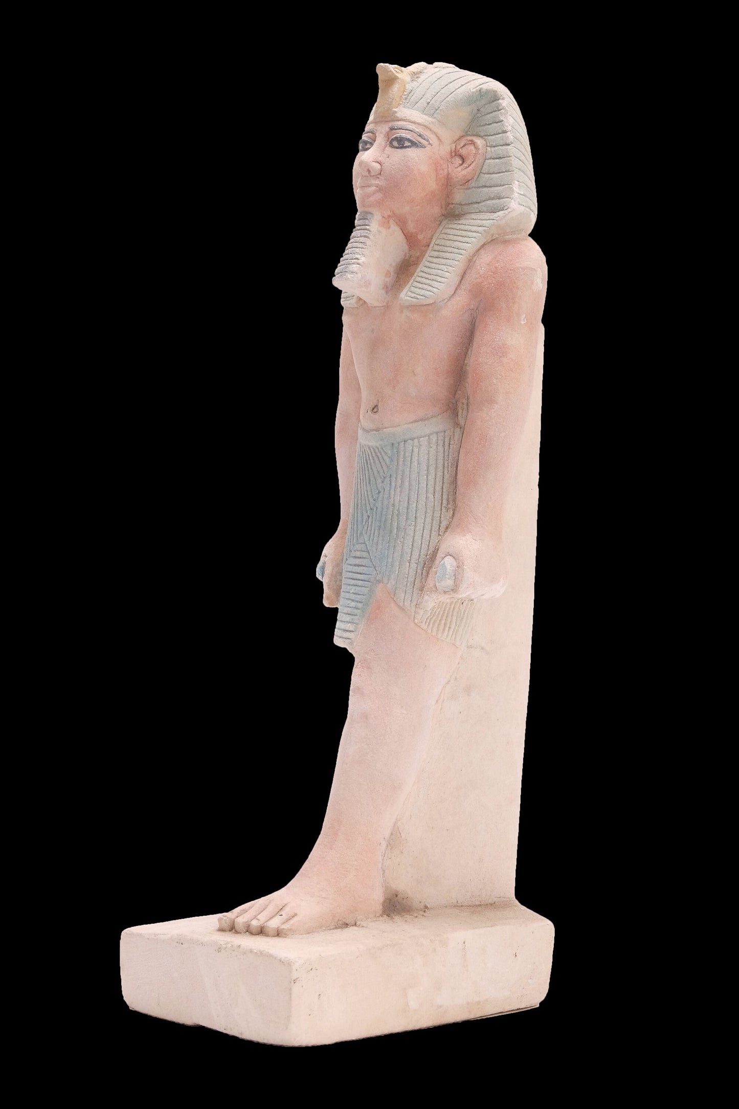 Ancient Egyptian statue of Pharaoh king Ramses II standing hand made from lime stone made in Egypt
