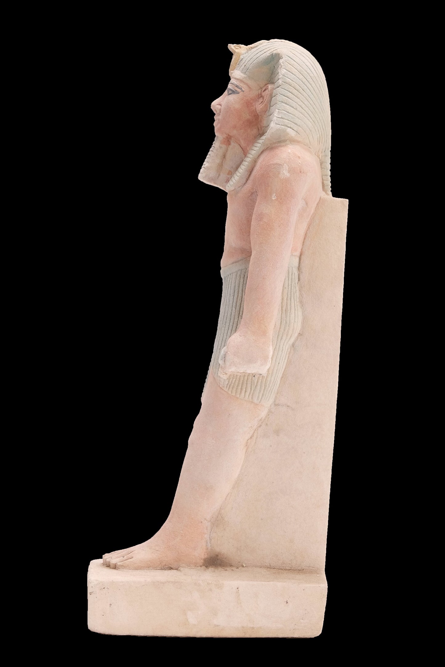 Ancient Egyptian statue of Pharaoh king Ramses II standing hand made from lime stone made in Egypt