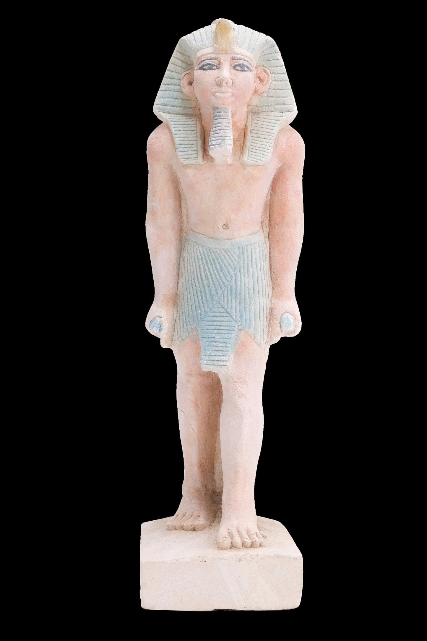 Ancient Egyptian statue of Pharaoh king Ramses II standing hand made from lime stone made in Egypt