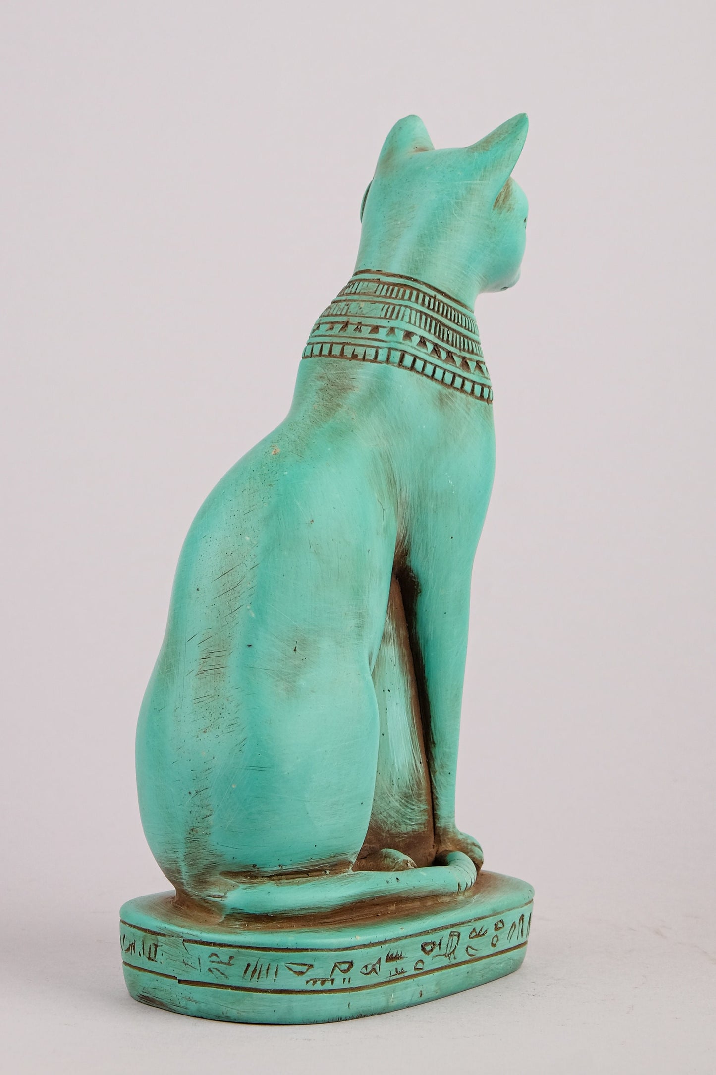 Egyptian statue of goddess Bastet cat heavy green stone made in Egypt. Bastet in her late form of a cat-headed woman, rather than a lioness