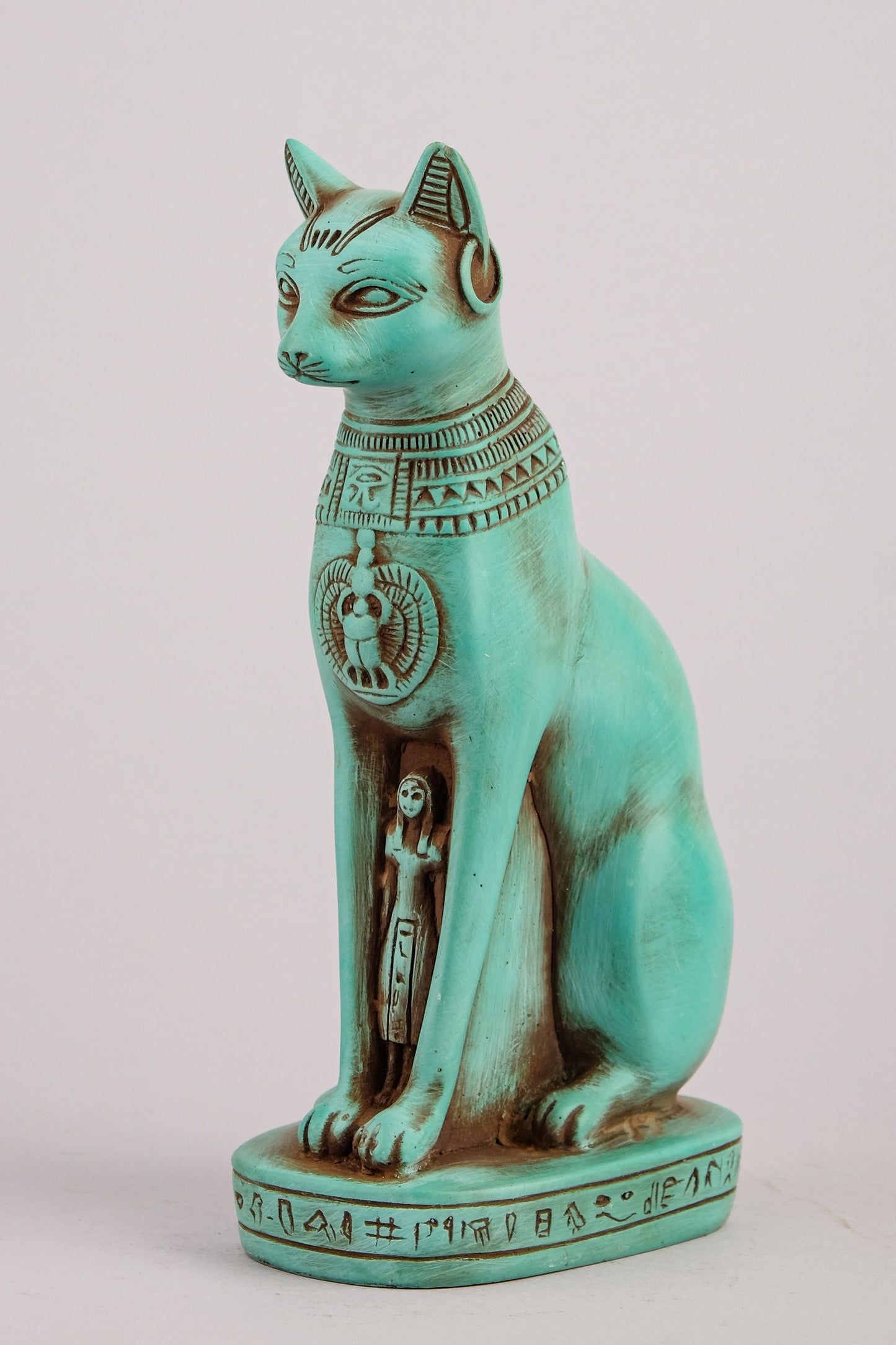 Egyptian statue of goddess Bastet cat heavy green stone made in Egypt. Bastet in her late form of a cat-headed woman, rather than a lioness