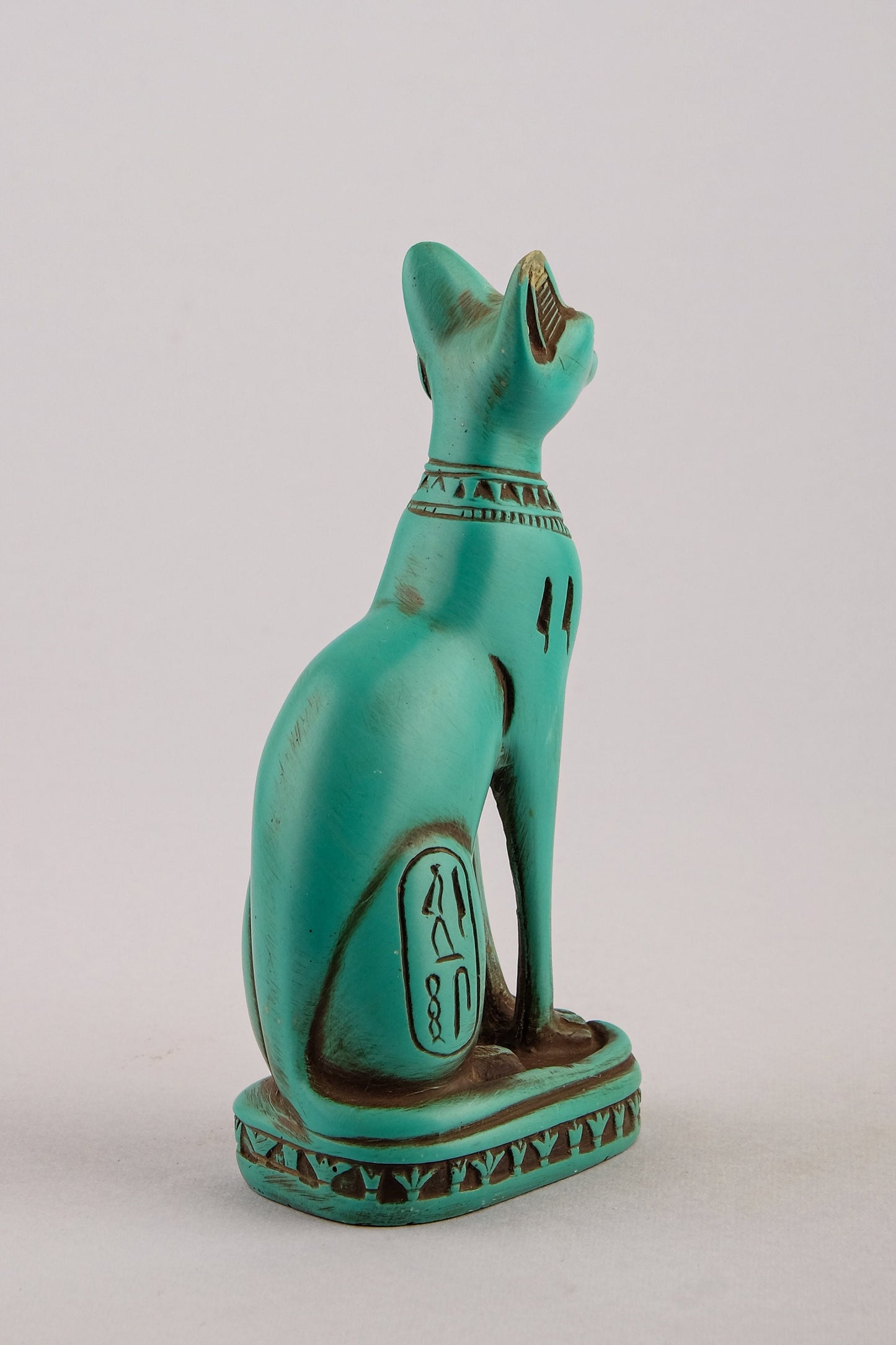 Unique ancient Egyptian Bastet cat Statue green stone with scarab on her chest, symbols hieroglyphic inscriptions around the base