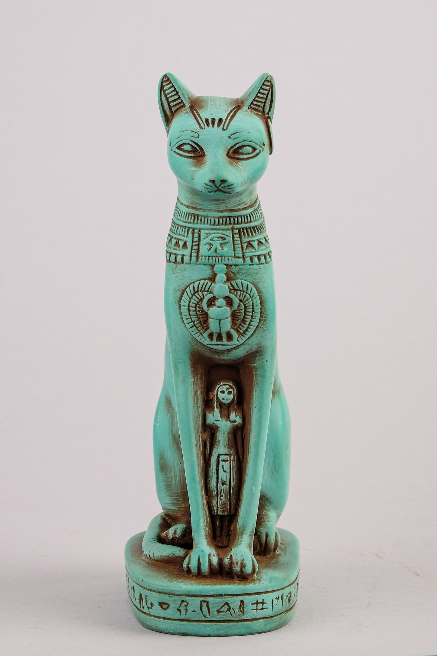 Egyptian statue of goddess Bastet cat heavy green stone made in Egypt. Bastet in her late form of a cat-headed woman, rather than a lioness