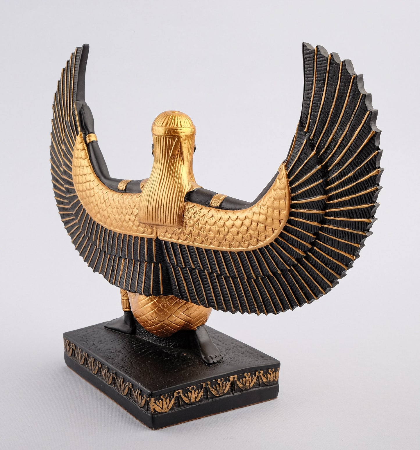 Egyptian statue of Isis gold black made in Egypt. Great mother Isis, the goddess of healing and magic her name mean Queen of the throne