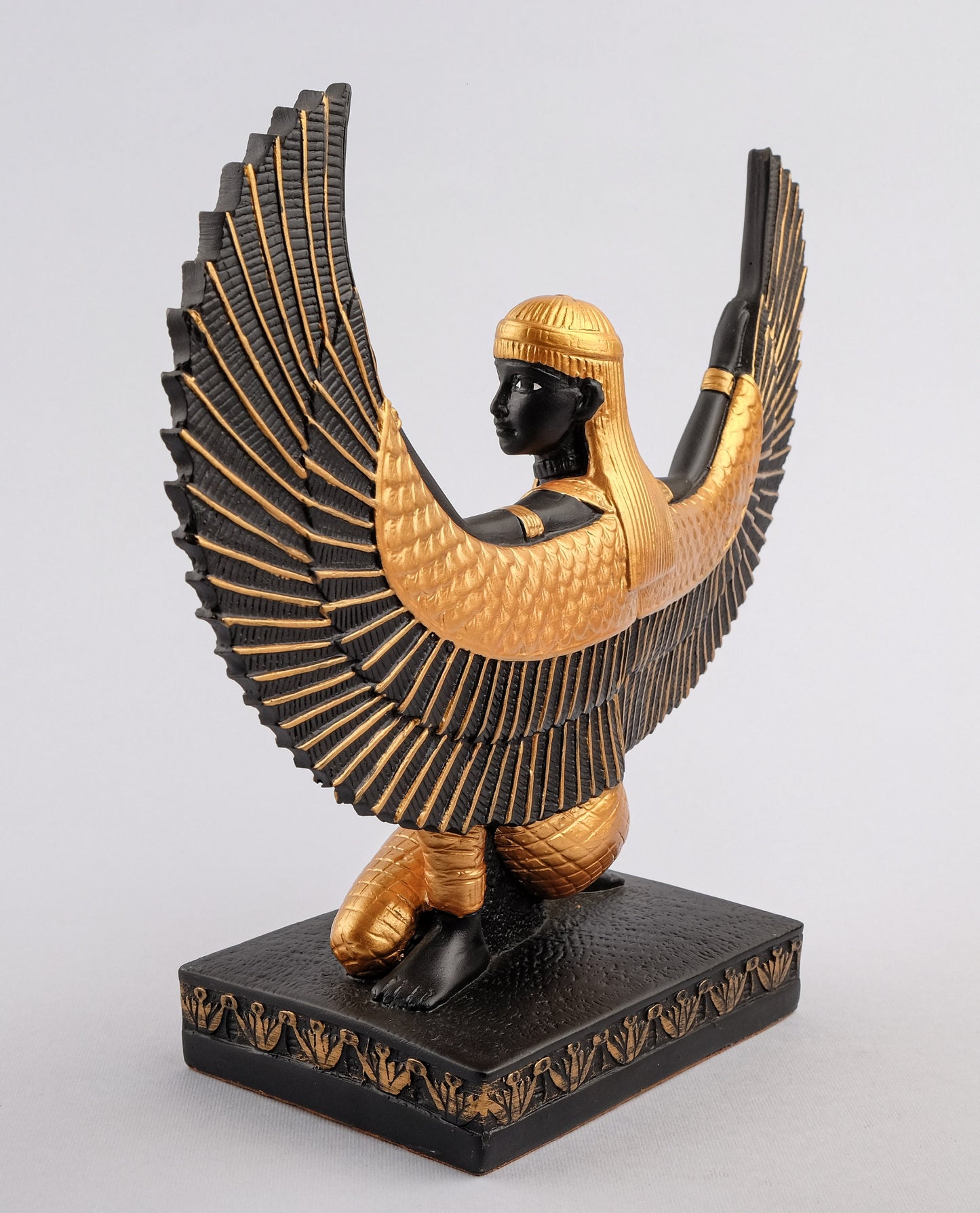 Egyptian statue of Isis gold black made in Egypt. Great mother Isis, the goddess of healing and magic her name mean Queen of the throne