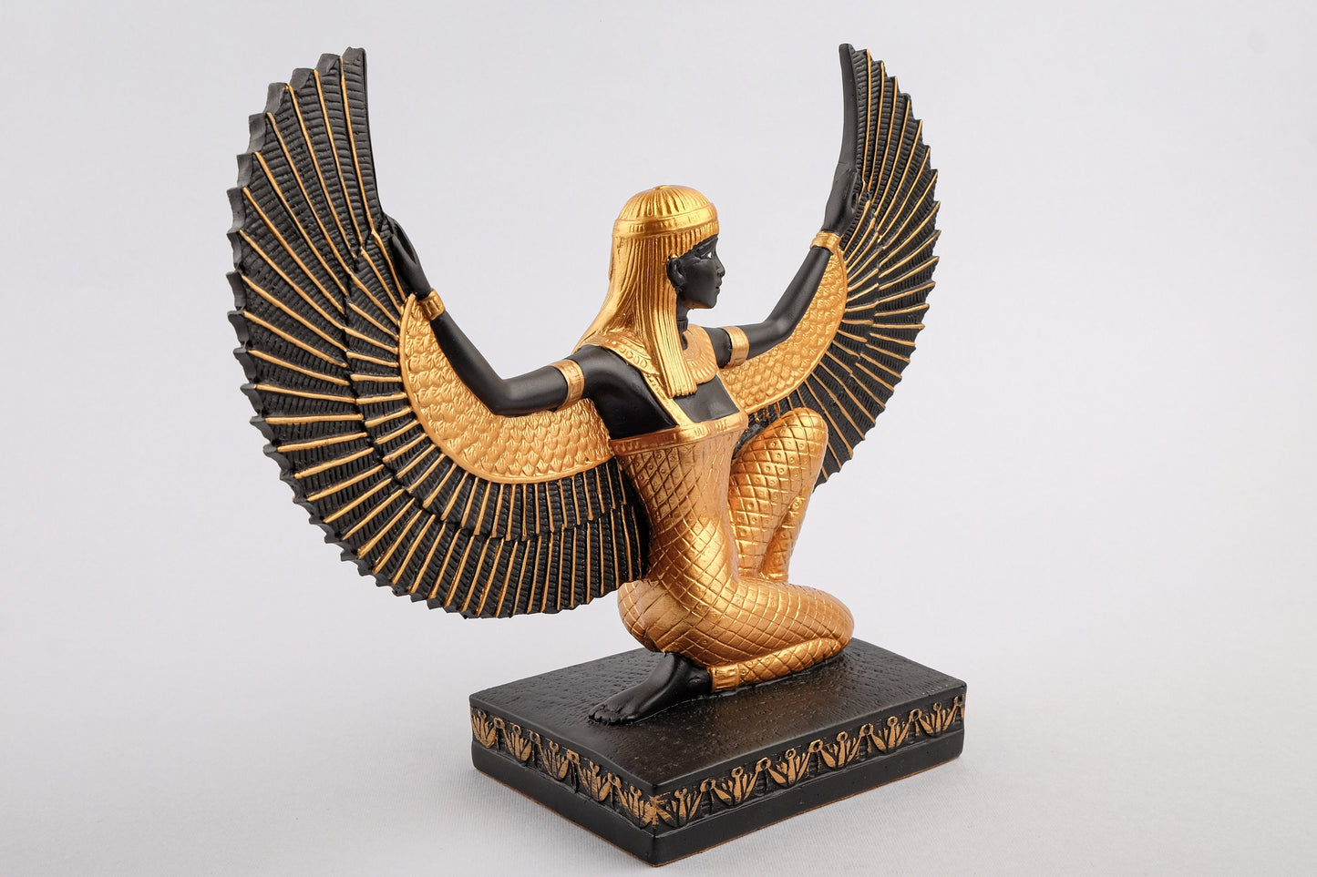 Egyptian statue of Isis gold black made in Egypt. Great mother Isis, the goddess of healing and magic her name mean Queen of the throne