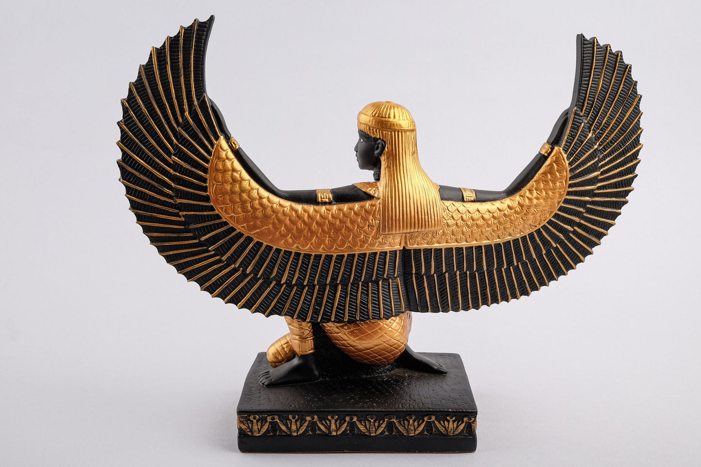 Egyptian statue of Isis gold black made in Egypt. Great mother Isis, the goddess of healing and magic her name mean Queen of the throne