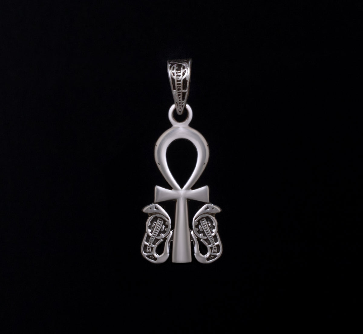 handcrafted Egyptian silver 925 pendant featuring the traditional Ankh symbol (Key of Life), detailed with protective Uraeus cobras on both sides."