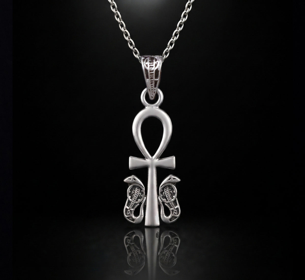 handcrafted Egyptian silver 925 pendant featuring the traditional Ankh symbol (Key of Life), detailed with protective Uraeus cobras on both sides."