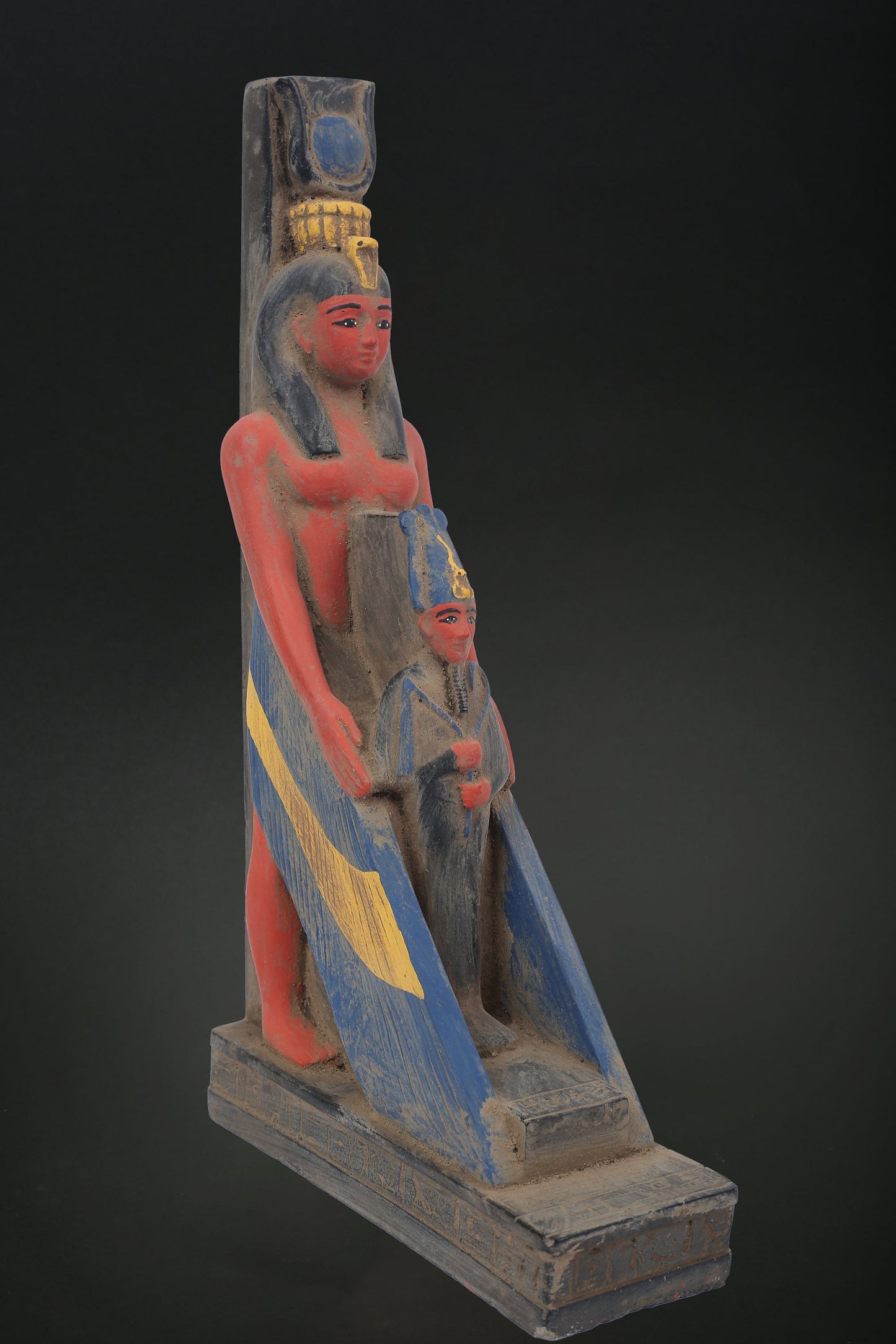 Vintage ancient statue of Egyptian art Goddess Isis Wings protect Osiris made of heavy stone