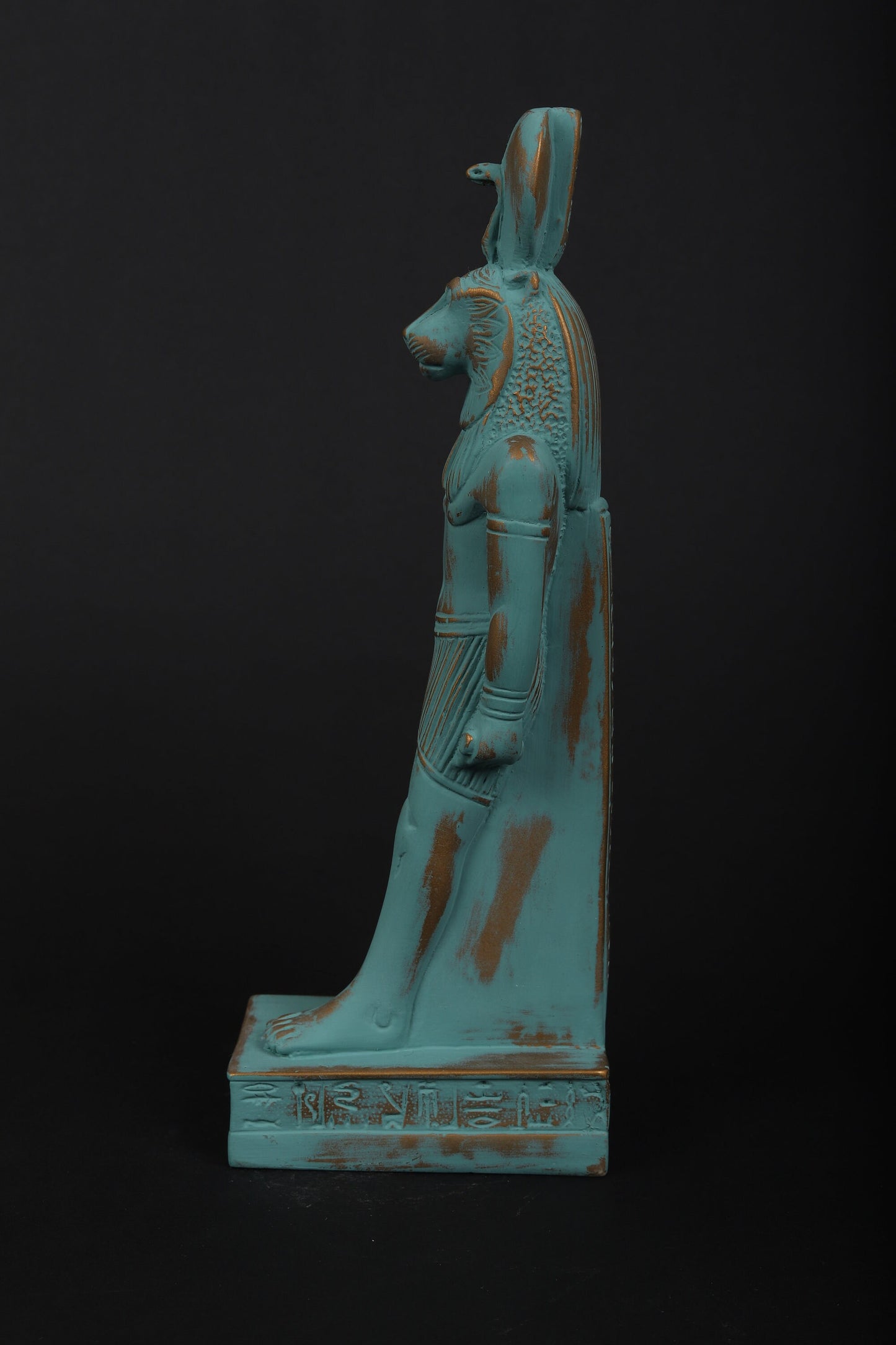 statue of Sekhmet Goddess of healing and War painted with a green color and gold antique