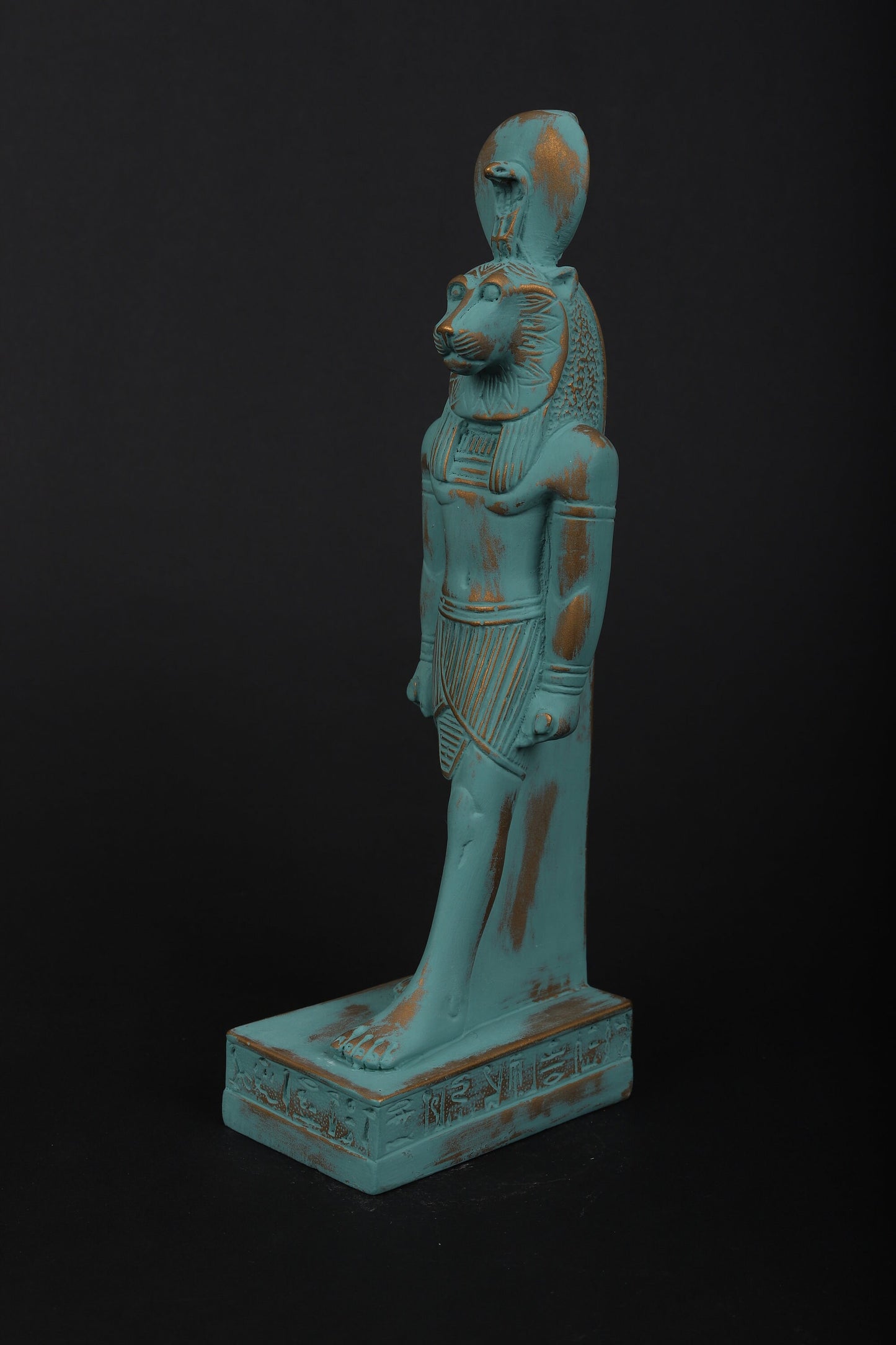 statue of Sekhmet Goddess of healing and War painted with a green color and gold antique