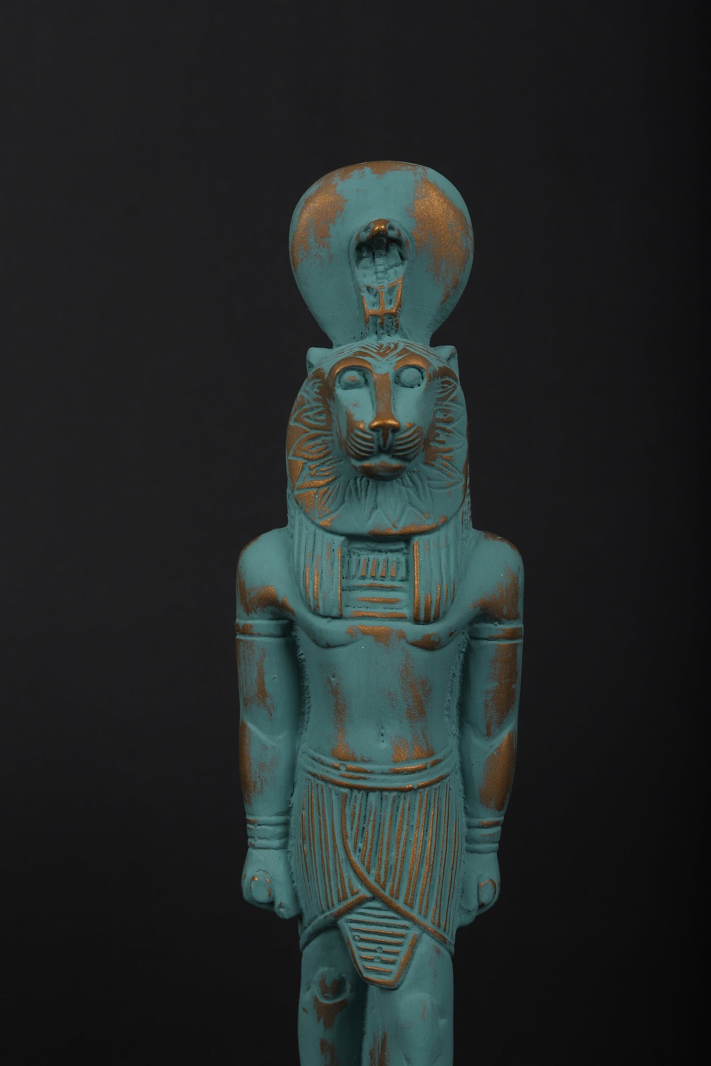 statue of Sekhmet Goddess of healing and War painted with a green color and gold antique