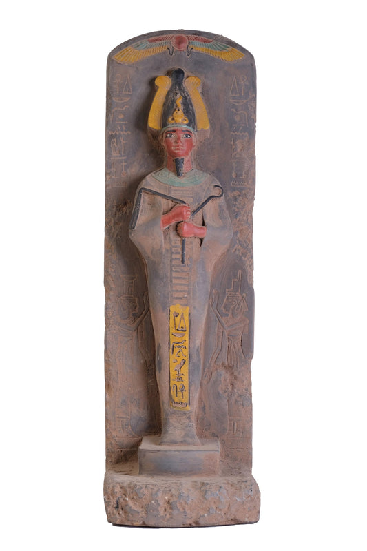 Statue antique of the Egyptian Osiris Lord of the Dead, The underworld and rebirth made of heavy stone with natural colors