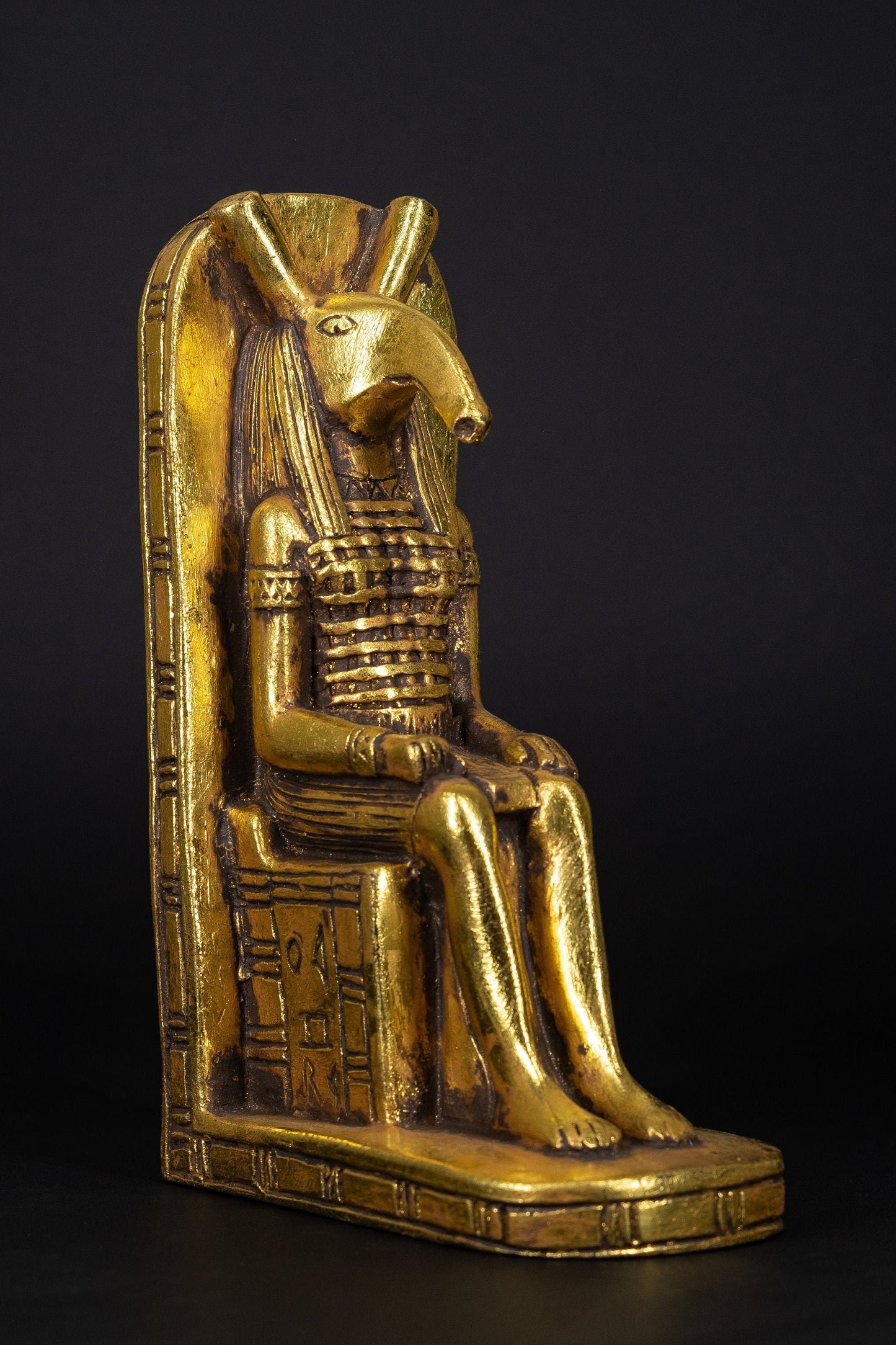 Egyptian statue of Seth seated on throne He was the god of chaos,violence,deserts and storms He is the murderer of his brother Osiris