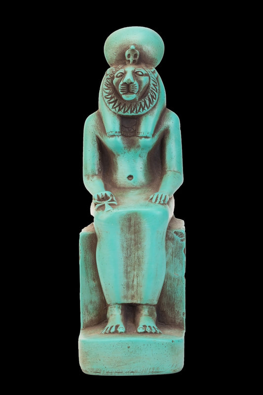 Seated statue of Sekhmet made of heavy stone green