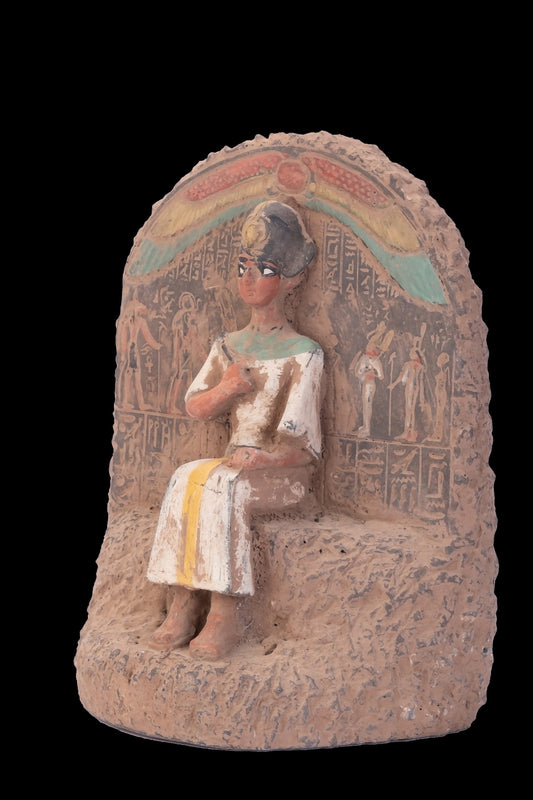 Ancient Egyptian statue of Pharaoh king Ramses II seated on the throne carved with ancient Egyptian hieroglyphics, great court