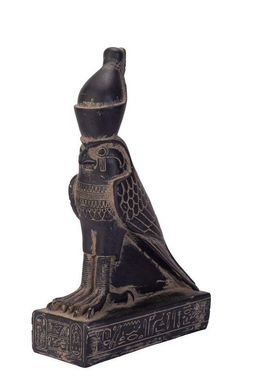 Statue of Horus god Falcon Bird sculpture large black heavy stone made in Egypt. Horus is the name of a sky god in ancient Egyptian religion