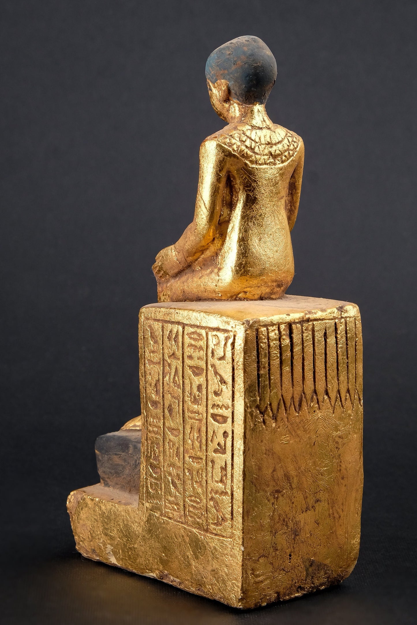 Statue of Egyptian Art seated statue of Imhotep holding an open papyrus scroll heavy stone gold leaf hand painted made in Egypt