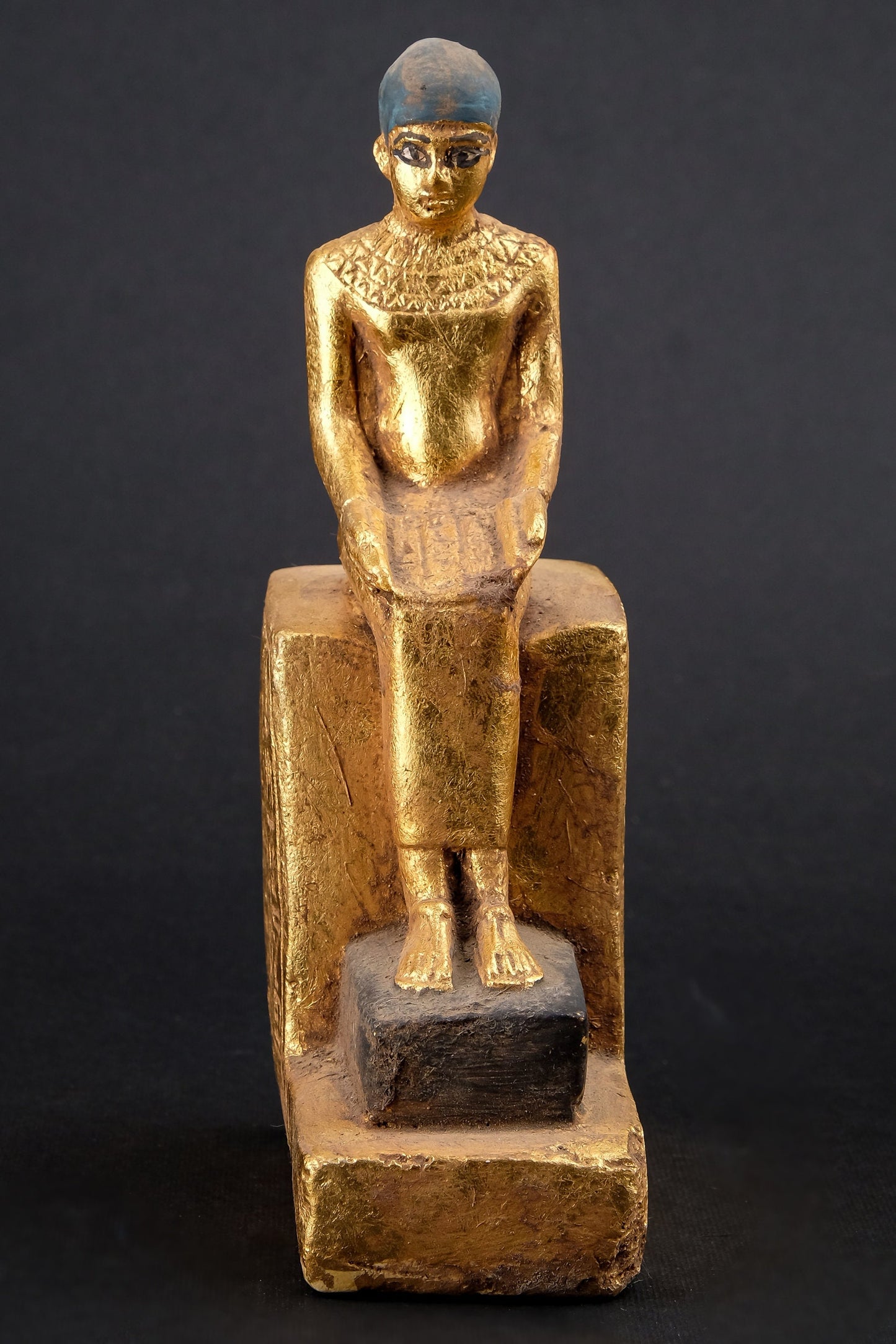 Statue of Egyptian Art seated statue of Imhotep holding an open papyrus scroll heavy stone gold leaf hand painted made in Egypt