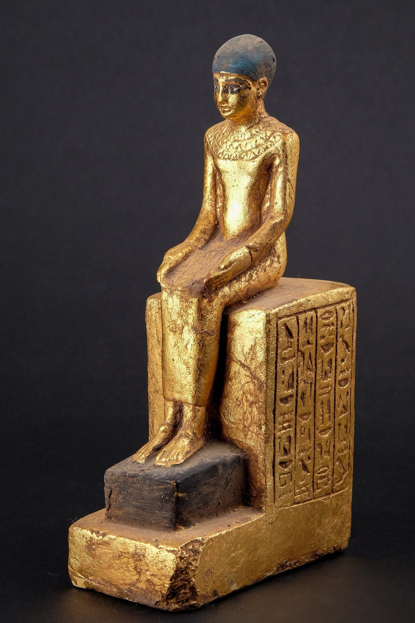 Statue of Egyptian Art seated statue of Imhotep holding an open papyrus scroll heavy stone gold leaf hand painted made in Egypt