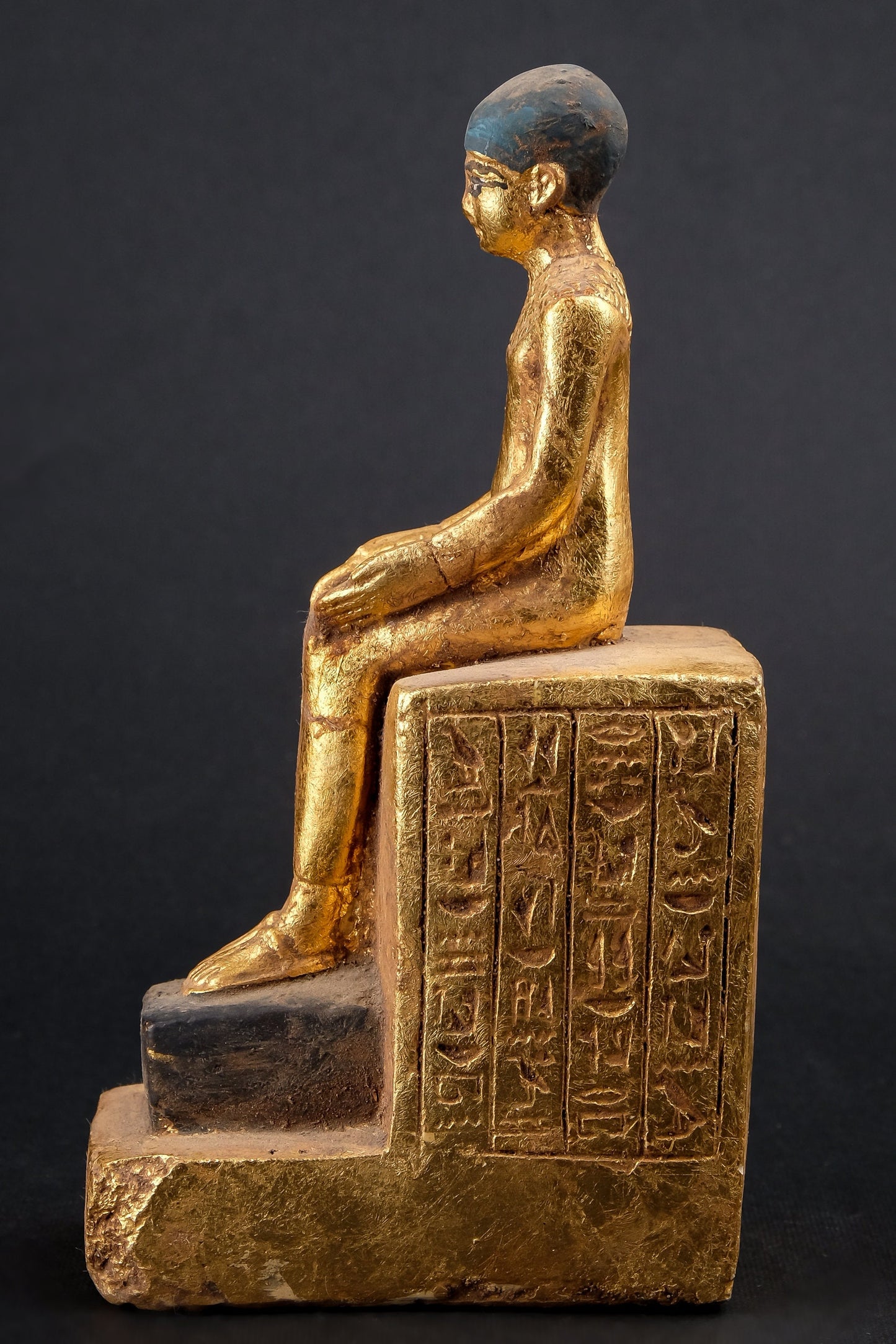 Statue of Egyptian Art seated statue of Imhotep holding an open papyrus scroll heavy stone gold leaf hand painted made in Egypt