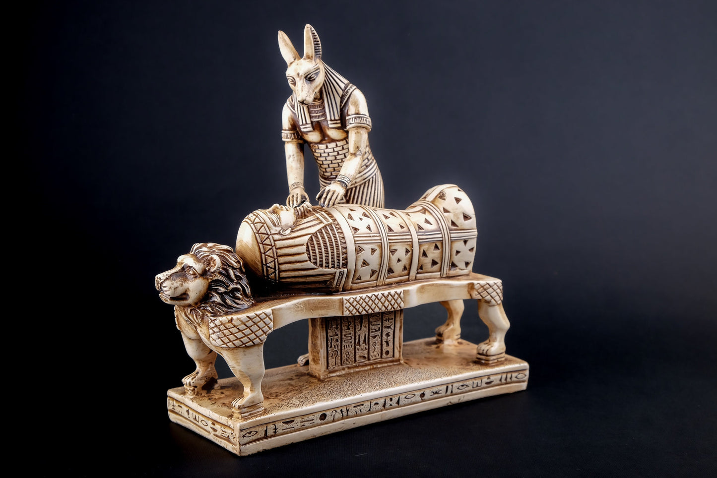 Egyptian god of afterlife Anubis mummify king Tutankhamun. God of underworld, king Tutankhamun Polystone made in Egypt