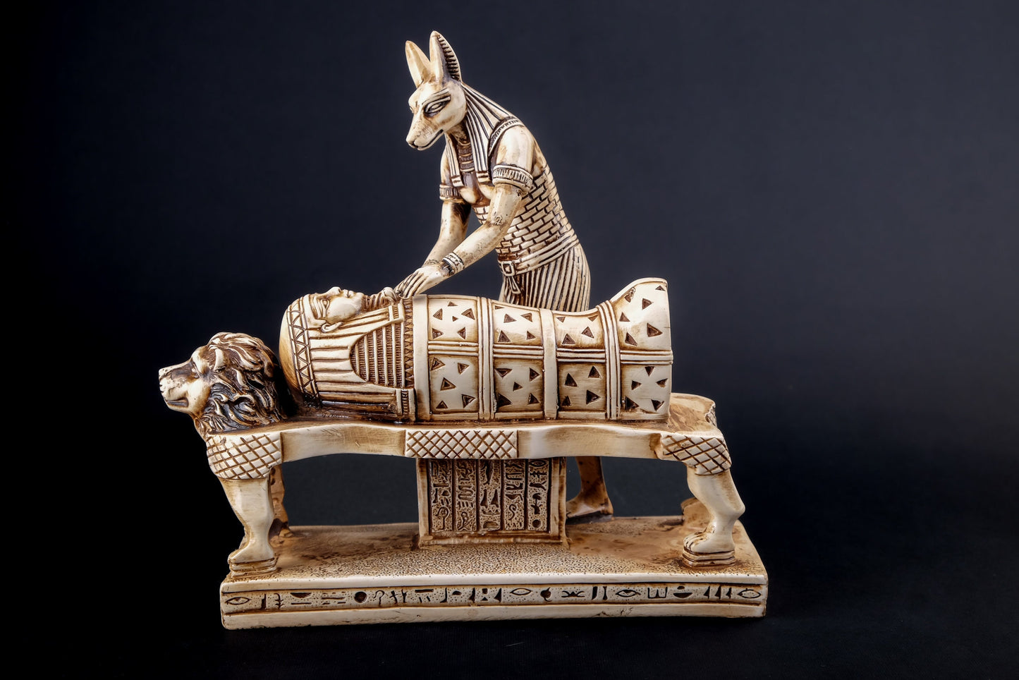 Egyptian god of afterlife Anubis mummify king Tutankhamun. God of underworld, king Tutankhamun Polystone made in Egypt