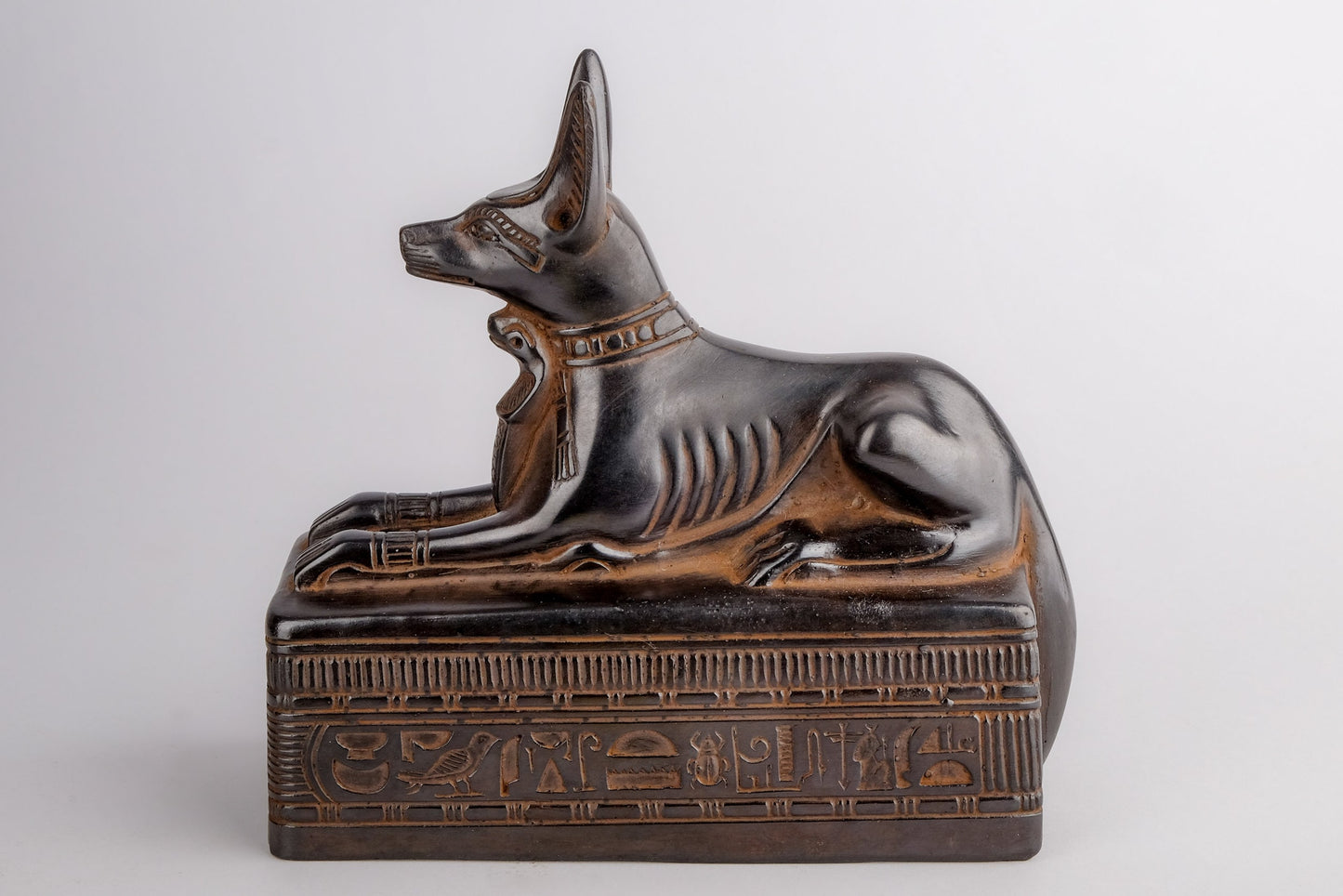 Ancient Egyptian statue of Anubis Jackal Symbol of afterlife and mummification seated to protect the tomb, heavy black stone made in Egypt