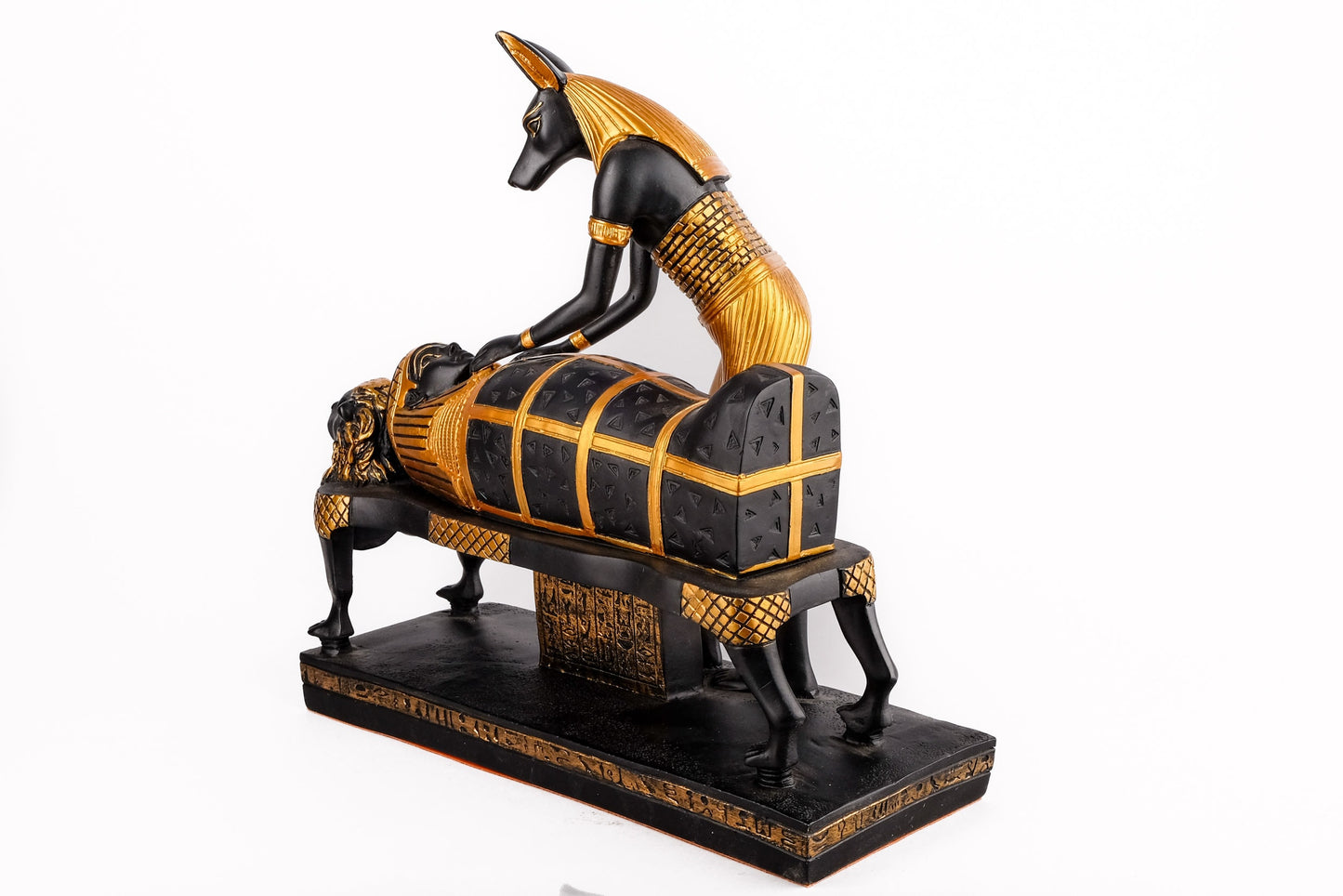 A unique ancient Egyptian statue of Anubis God of afterlife mummify king Tutankhamun, painted gold with colors Manifest piece made in Egypt