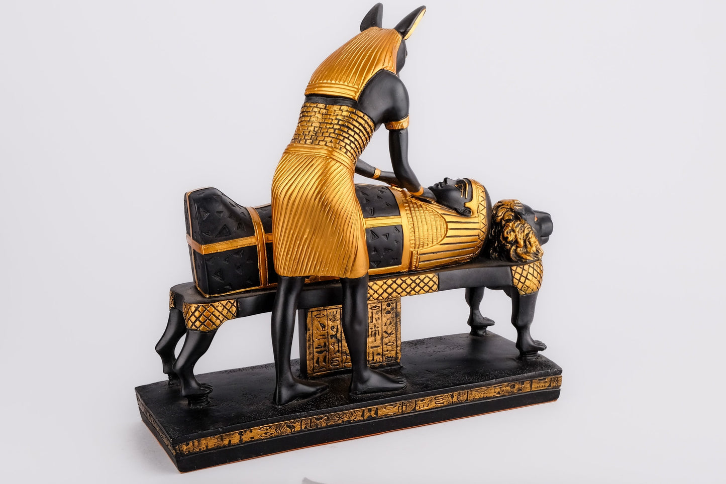 A unique ancient Egyptian statue of Anubis God of afterlife mummify king Tutankhamun, painted gold with colors Manifest piece made in Egypt