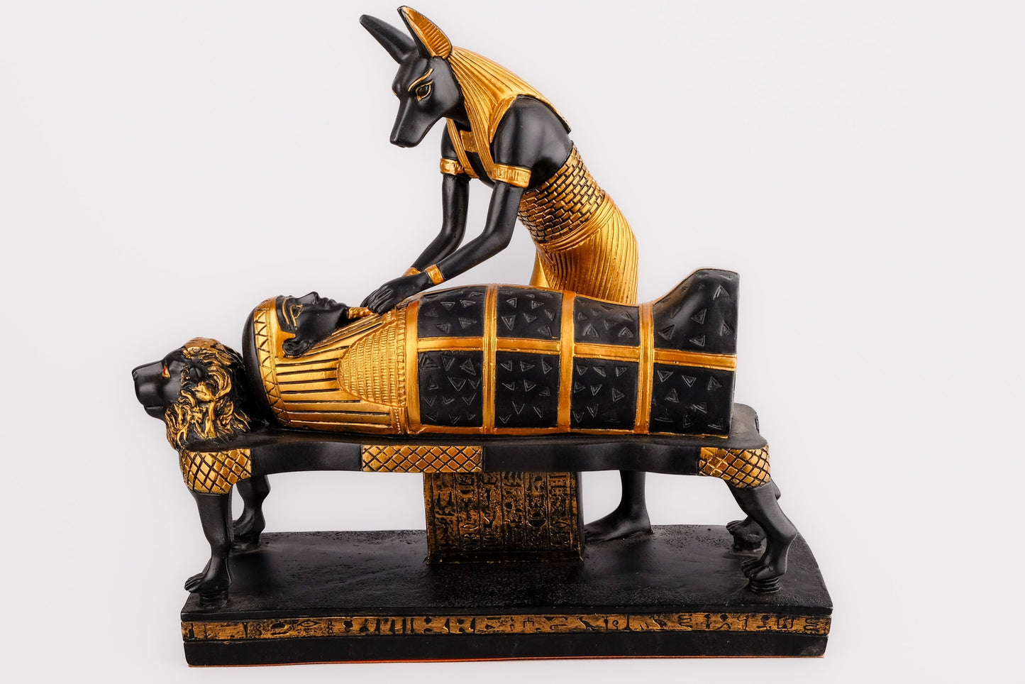 A unique ancient Egyptian statue of Anubis God of afterlife mummify king Tutankhamun, painted gold with colors Manifest piece made in Egypt