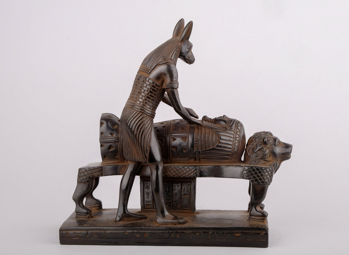 Egyptian god of afterlife Anubis mummify king Tutankhamun. God of underworld, king Tutankhamun . Heavy black made in Egypt