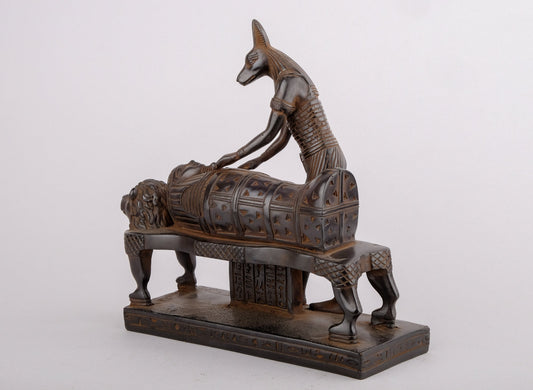 Egyptian god of afterlife Anubis mummify king Tutankhamun. God of underworld, king Tutankhamun . Heavy black made in Egypt