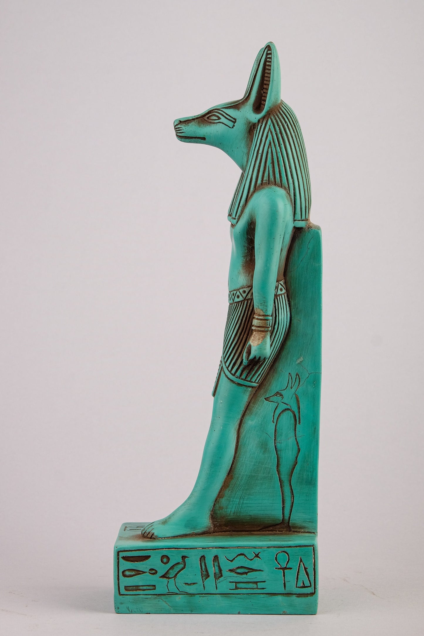 A unique ancient Egyptian statue of Anubis Jackal God of afterlife and mummification standing with jackal head and human body