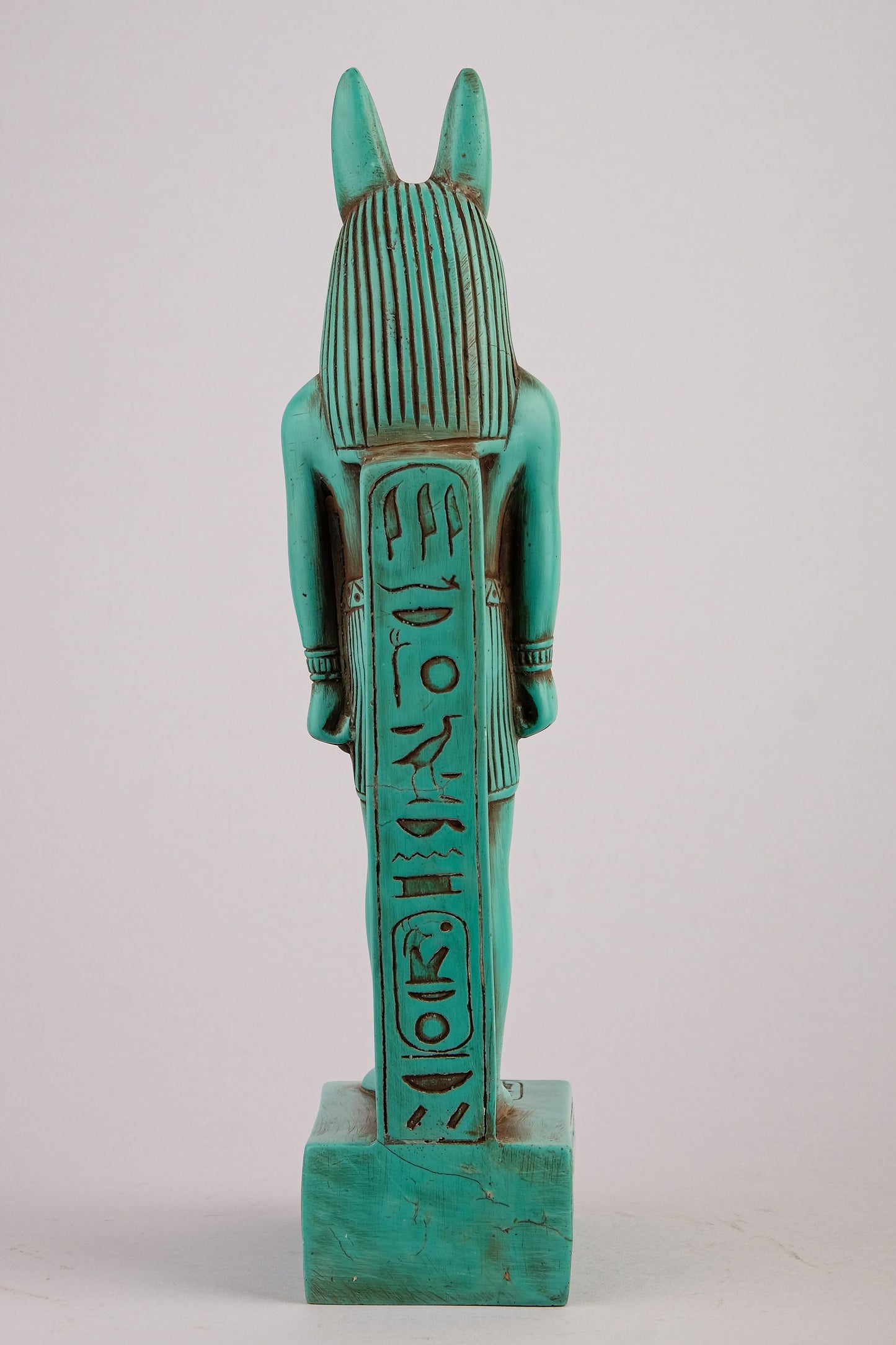 A unique ancient Egyptian statue of Anubis Jackal God of afterlife and mummification standing with jackal head and human body