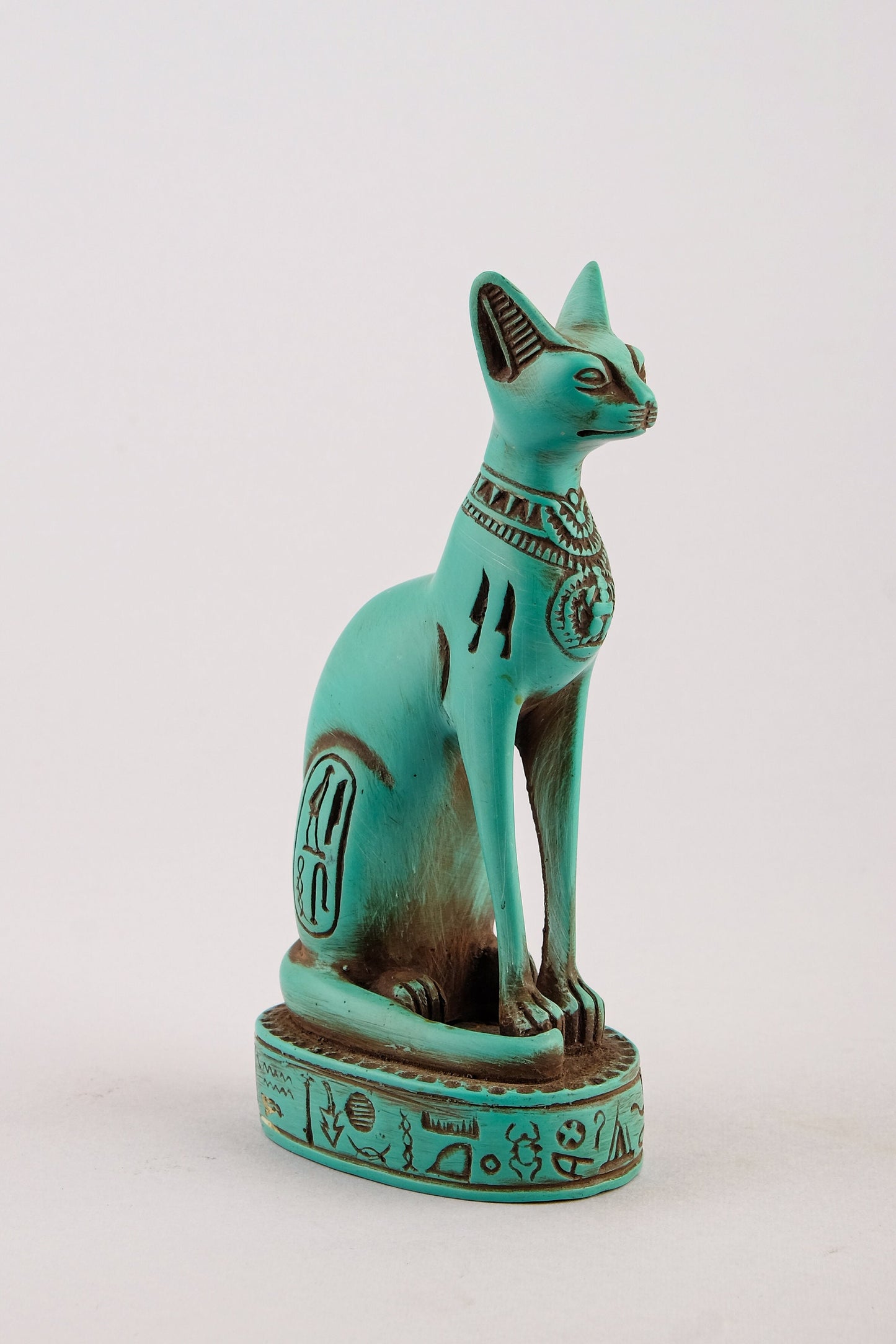 Ancient Egyptian Bastet cat Statue heavy green stone with scarab on her chest, symbols hieroglyphic inscriptions around the base