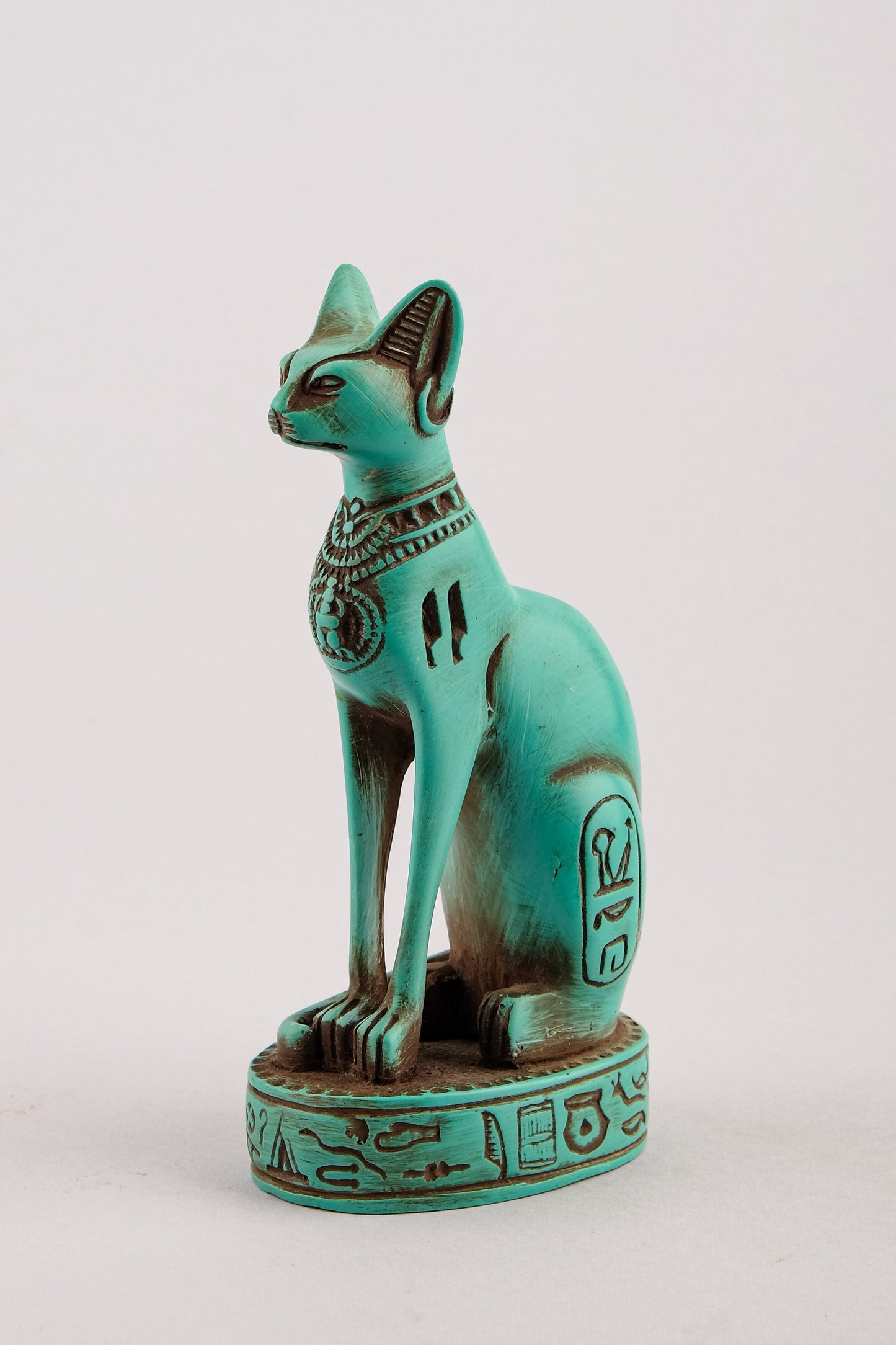 Ancient Egyptian Bastet cat Statue heavy green stone with scarab on her chest, symbols hieroglyphic inscriptions around the base