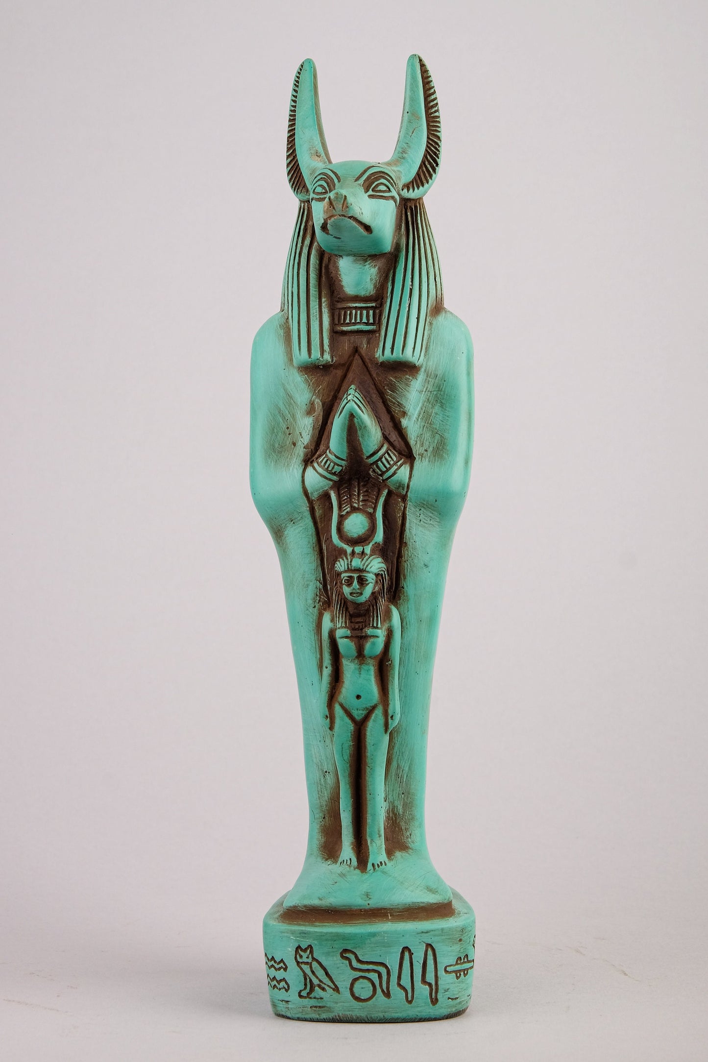 Egyptian statue of Anubis green Jackal God of afterlife and mummification standing with jackal head and human body with goddess Isis