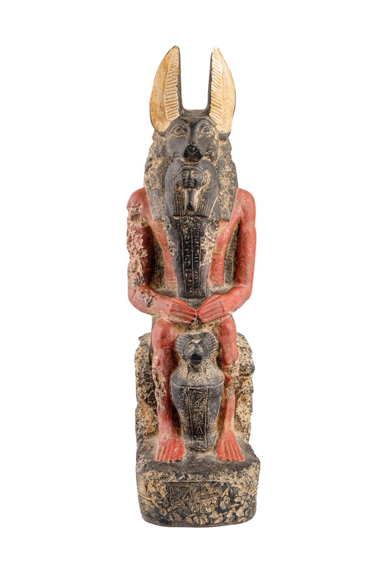 Seated Anubis Jackal holding a mummy form with a Hapi (Son of Horus) resting between his legs heavy stone handcrafted made in Egypt