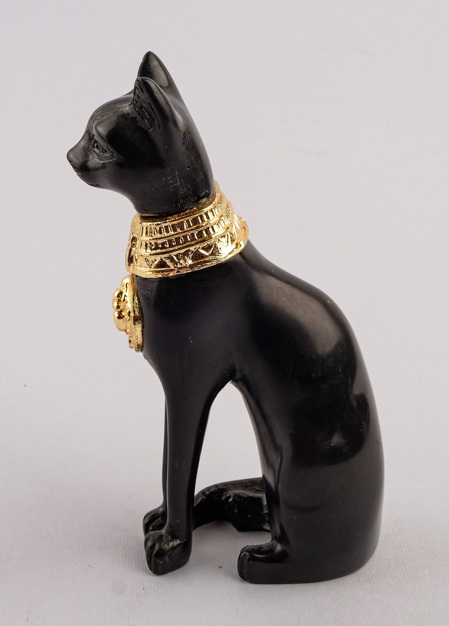 Unique ancient Egyptian statue cat Bastet Black Sculpture with front gold metal scarab, gold metal eye of Horus made in Egypt