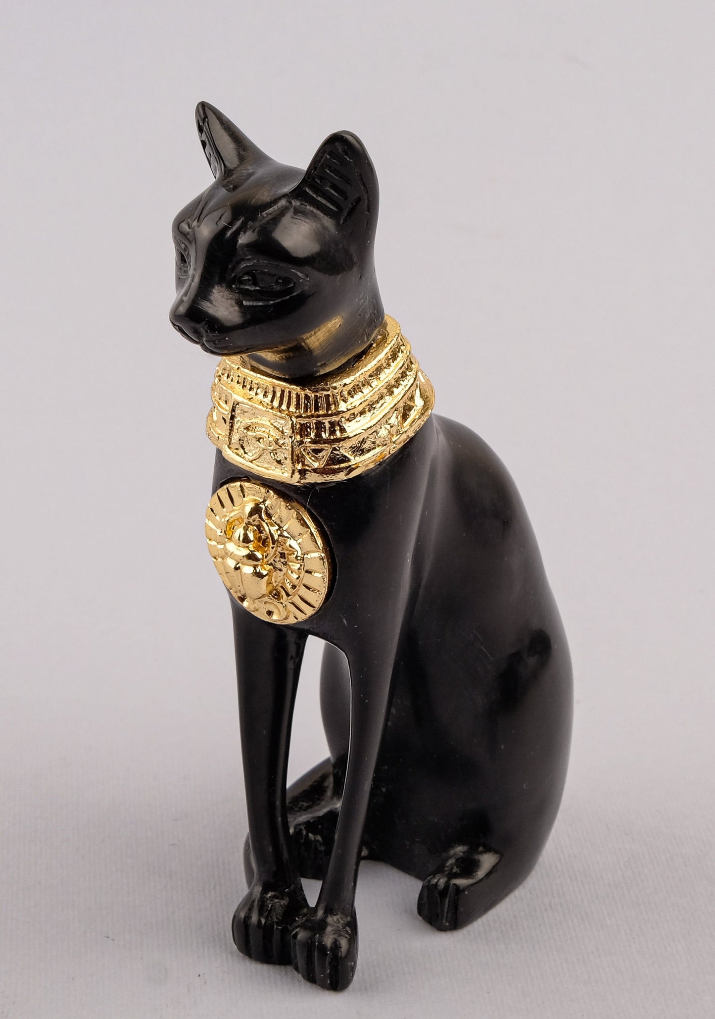 Unique ancient Egyptian statue cat Bastet Black Sculpture with front gold metal scarab, gold metal eye of Horus made in Egypt